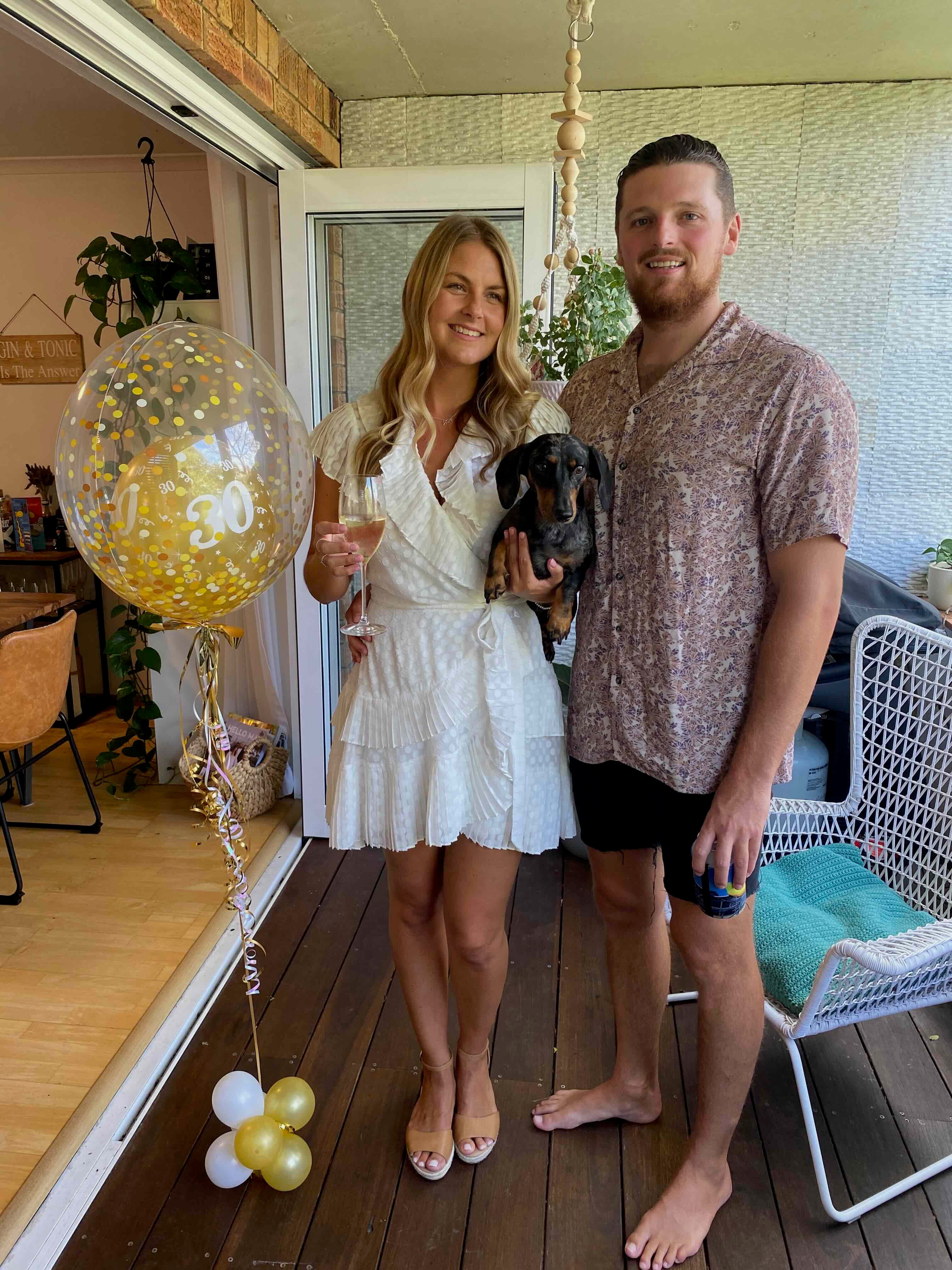 picture of caitlin and james with Harvey. They are the owners of dachshund lovers